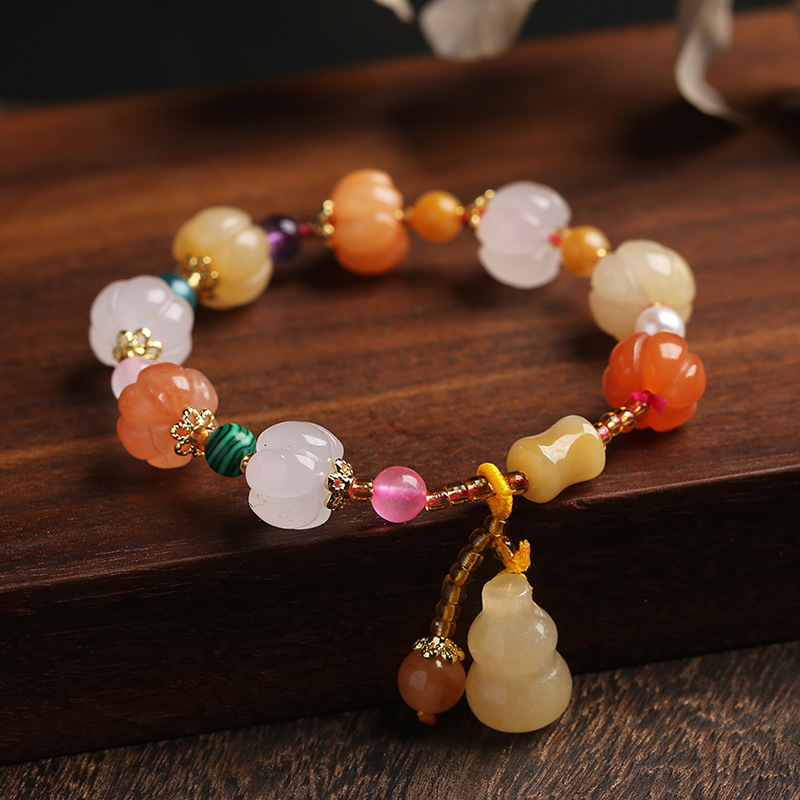 Colorful beaded bracelet on a wooden surface