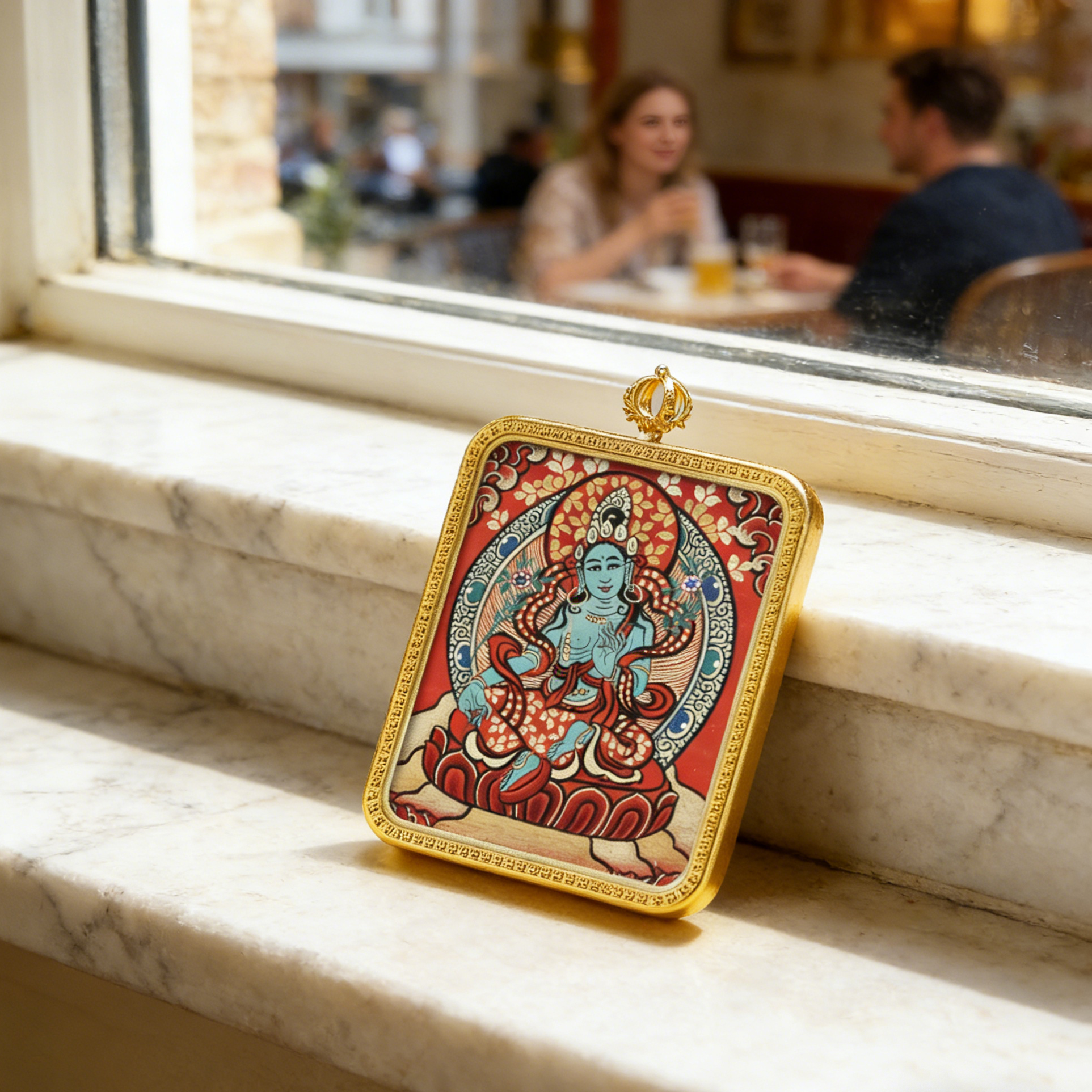 Decorative plaque with a colorful design on a marble ledge in a cafe setting