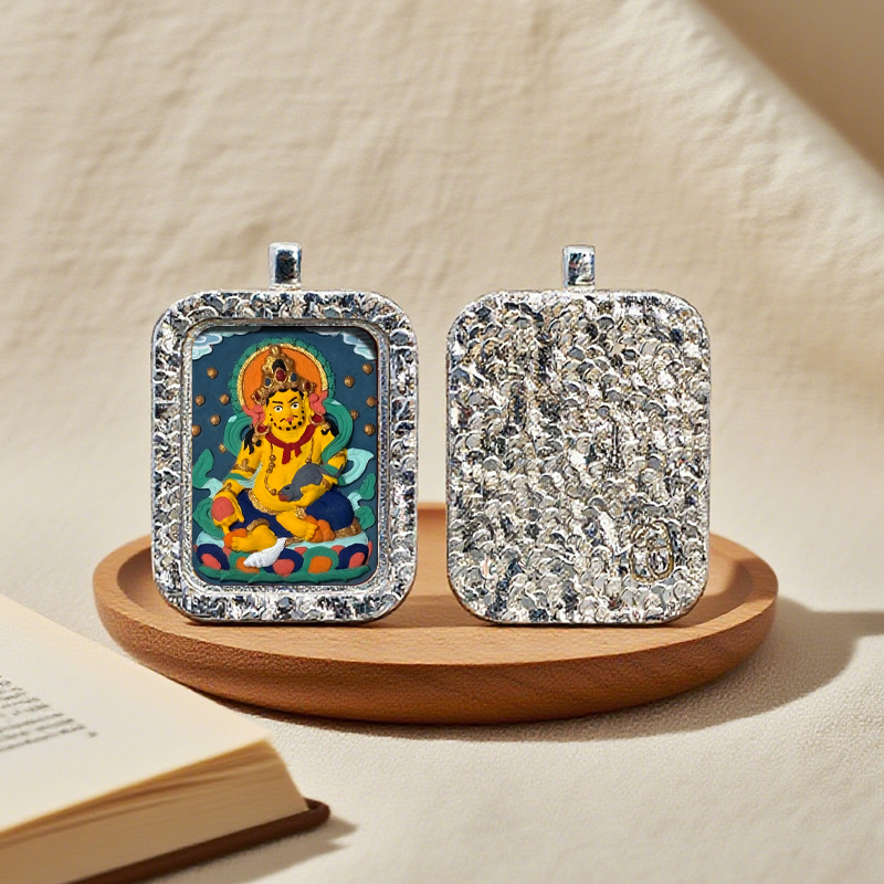 Two decorative pendants on a wooden stand with a book in the background